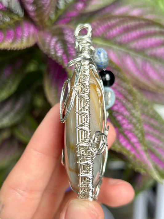 Flower Agate Carved Moon Pendant