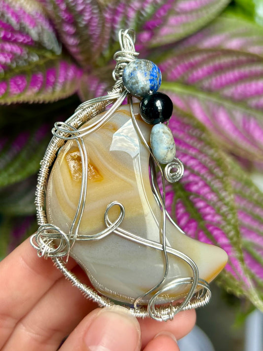 Flower Agate Carved Moon Pendant